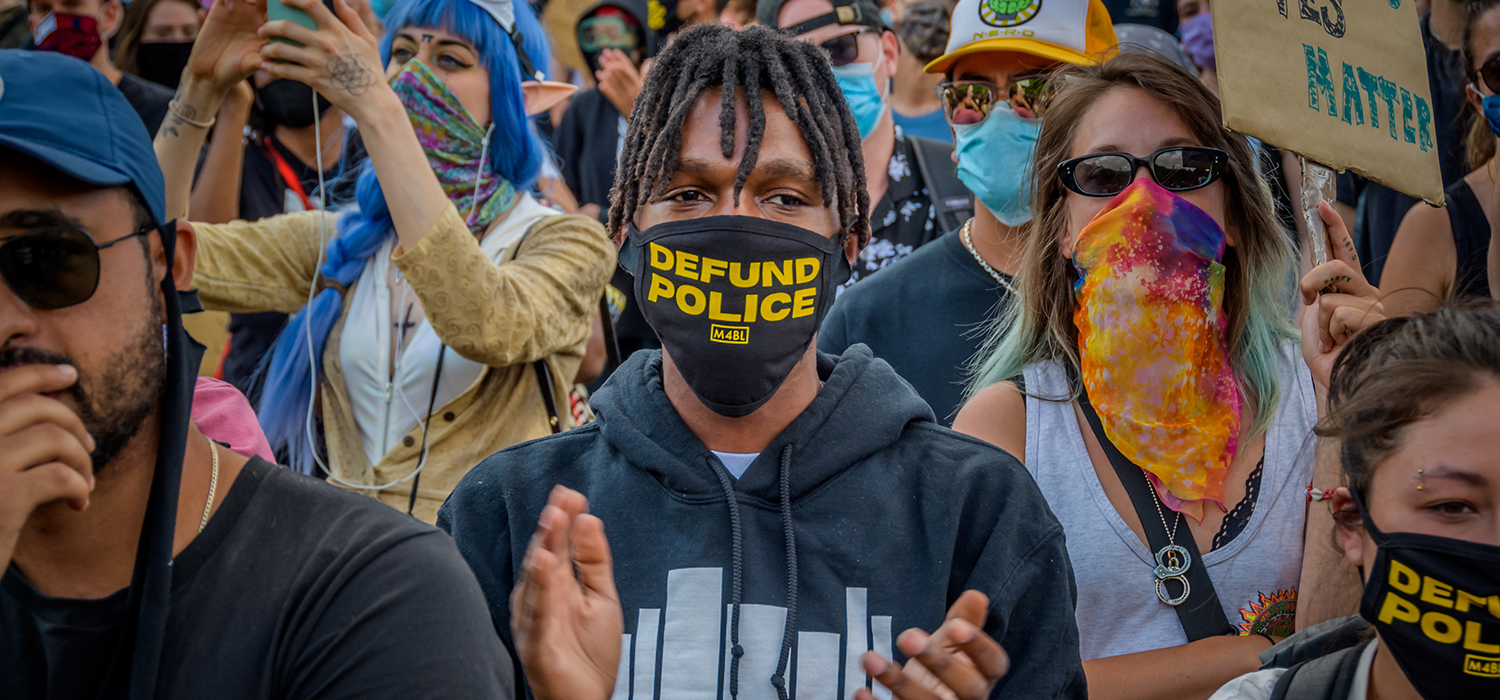 A participant wearing a face mask with the words Defund Police in it. Thousands of protesters gathered at Mc Carren Park in Brooklyn for a massive march around Williamsburg, making a loud call for the defunding of the police force. 