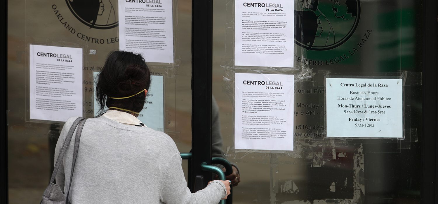 Woman enters a nonprofit organization that provides legal services to immigrants