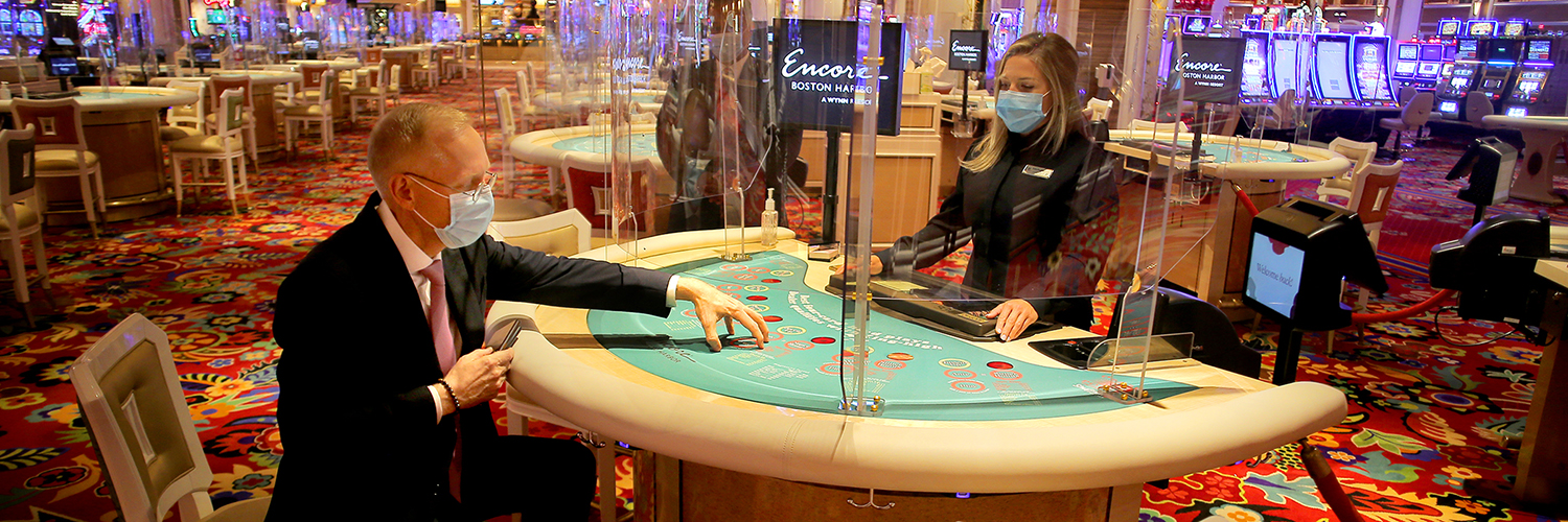 Man plays table games at a casino during COVID-19