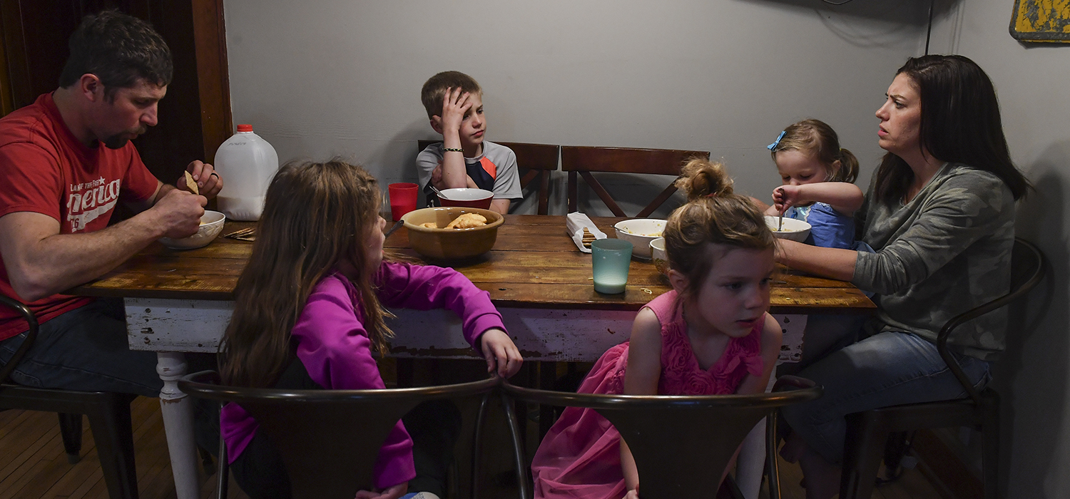 A family around the dinner table.