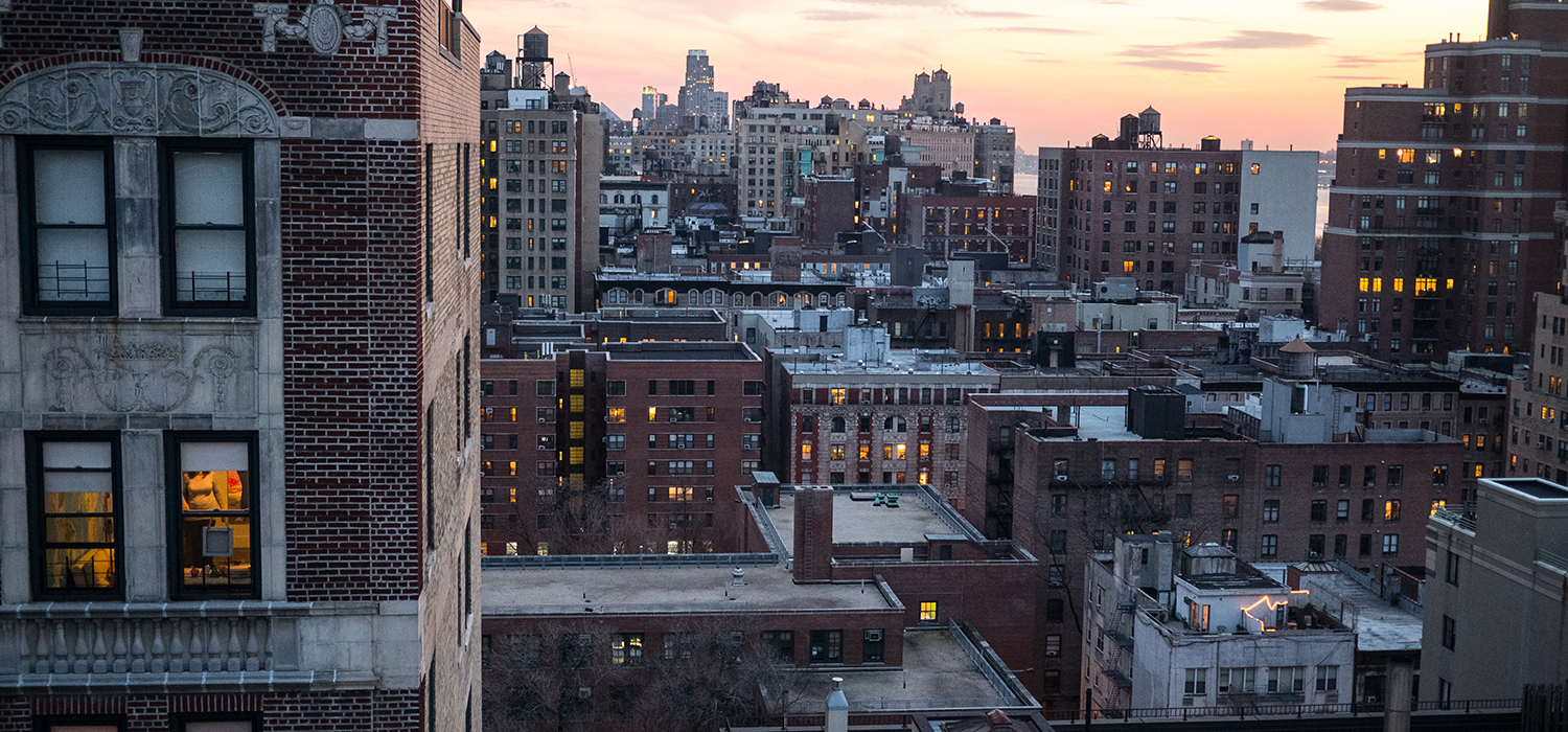 Wide shot of city buildings.