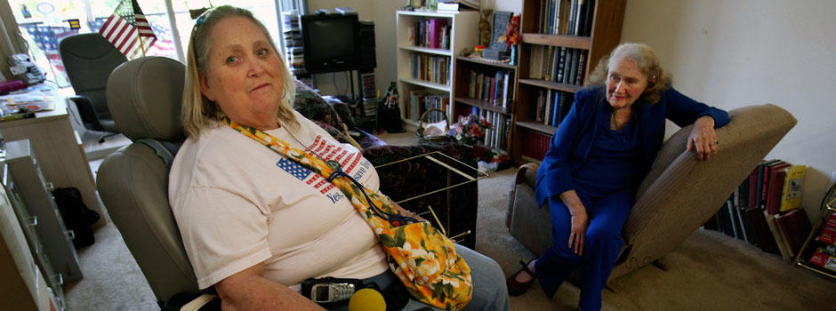 Two elderly women sitting in living room