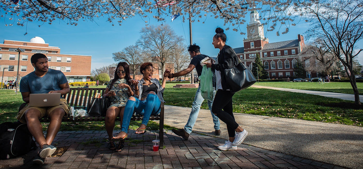 Students socialize between classes on the Yard.