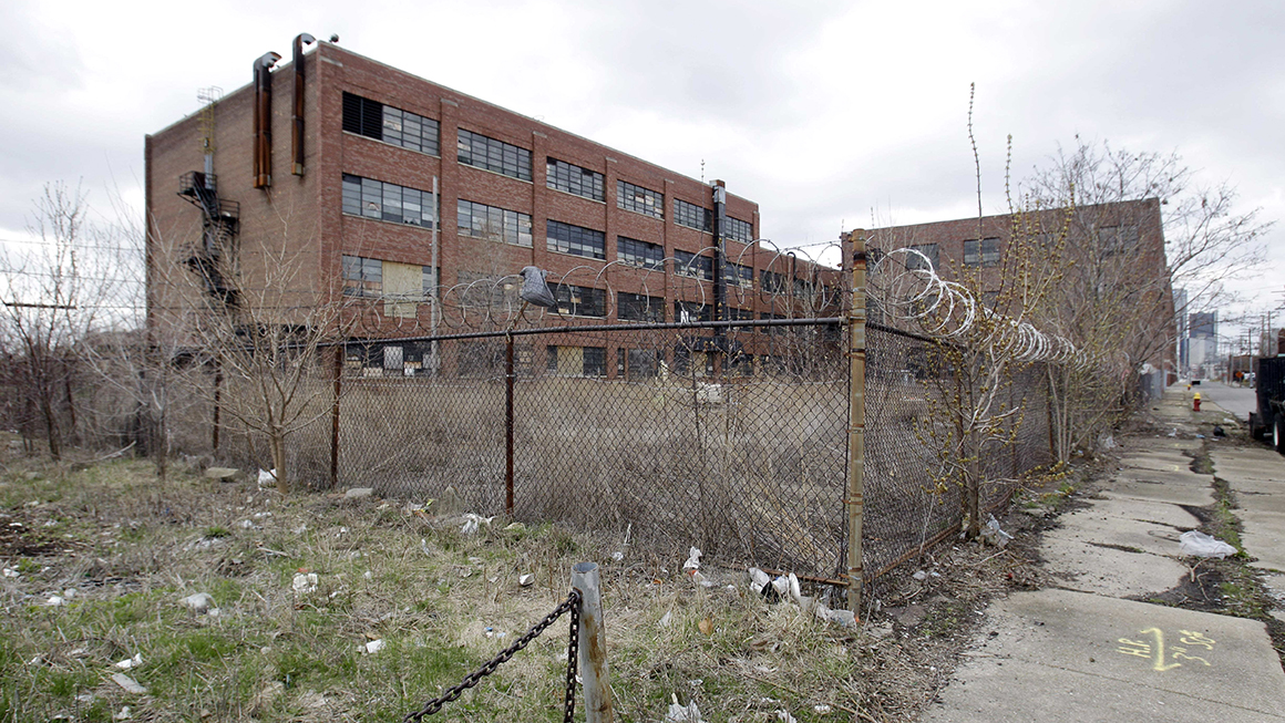 A vacant warehouse is shown in Detroit