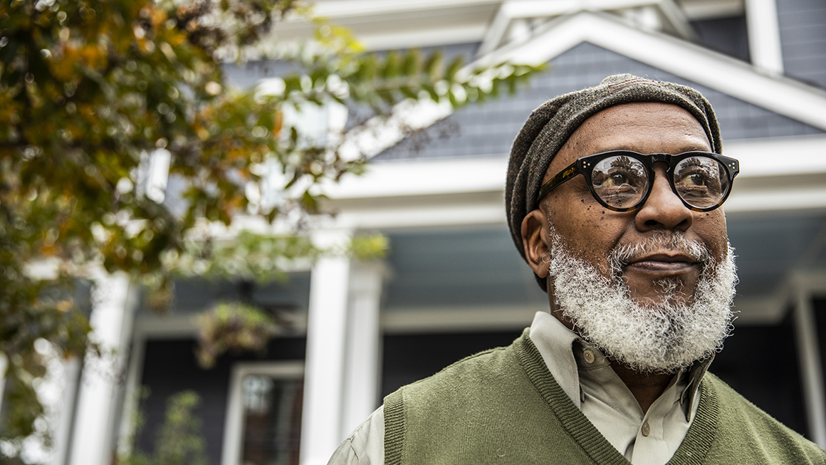 Man in front of a house
