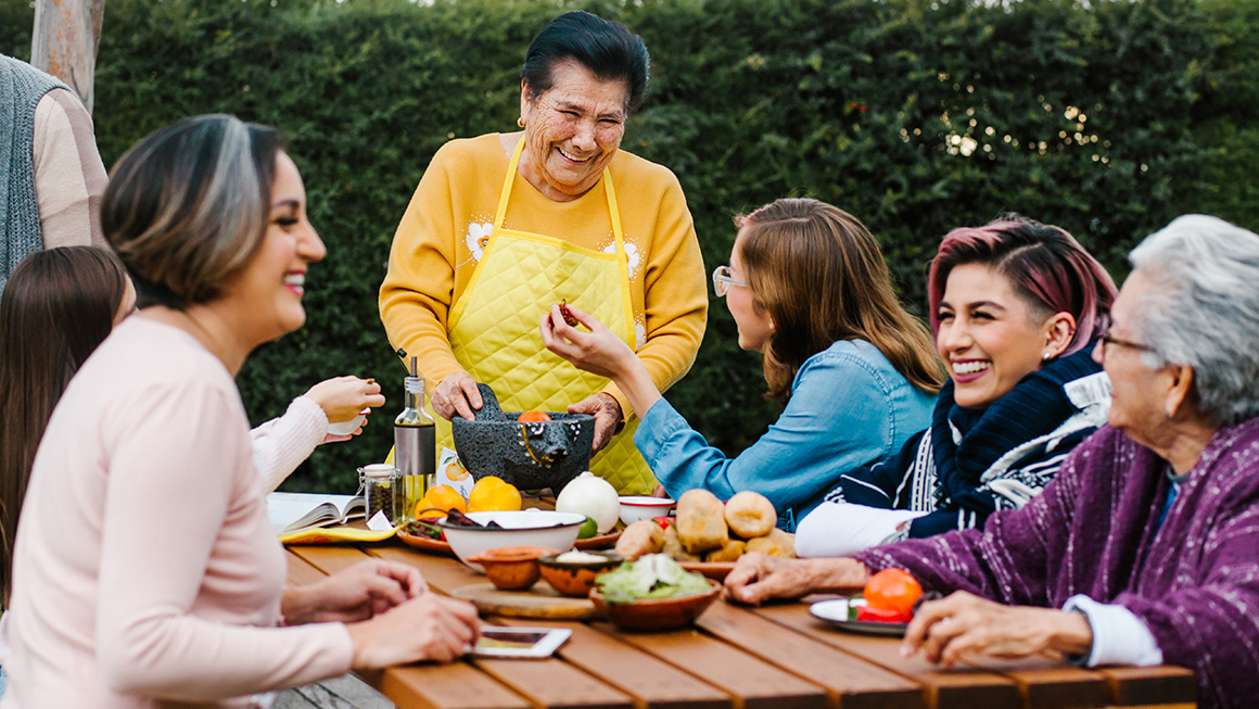 Group of people around a table. 