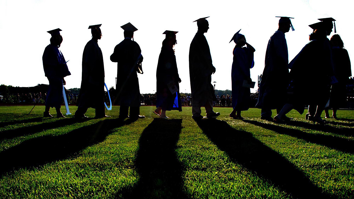 Group of student in graduation gowns. 