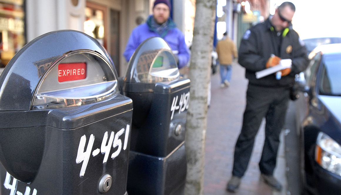 Reporter Ray Routhier follows Portland Parking Control Officer Chad Jones as he writes out a ticket during his rounds in the Old Port. 