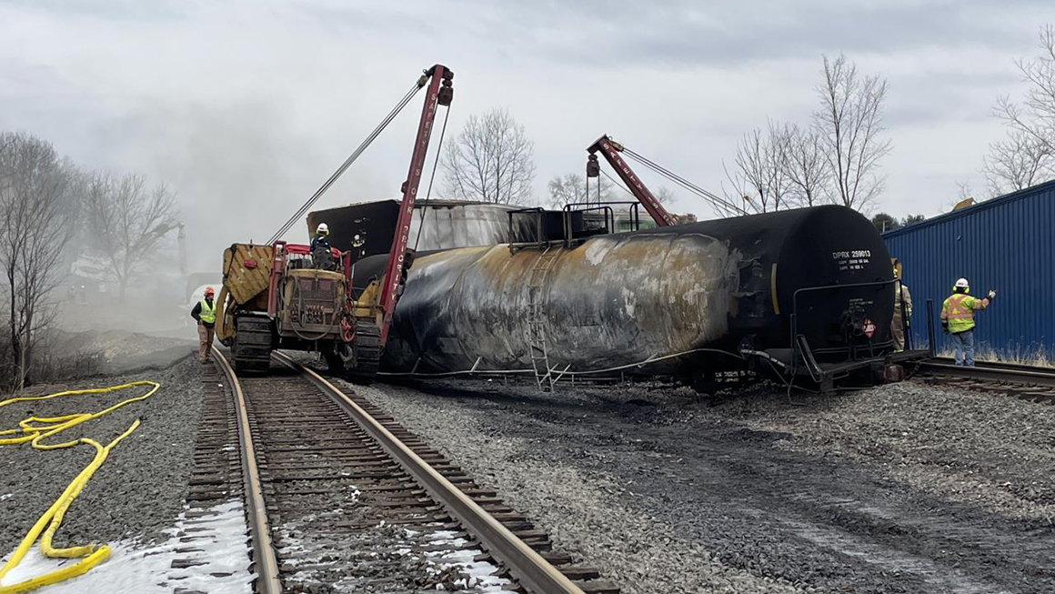 A rail road train derailed off it's track.