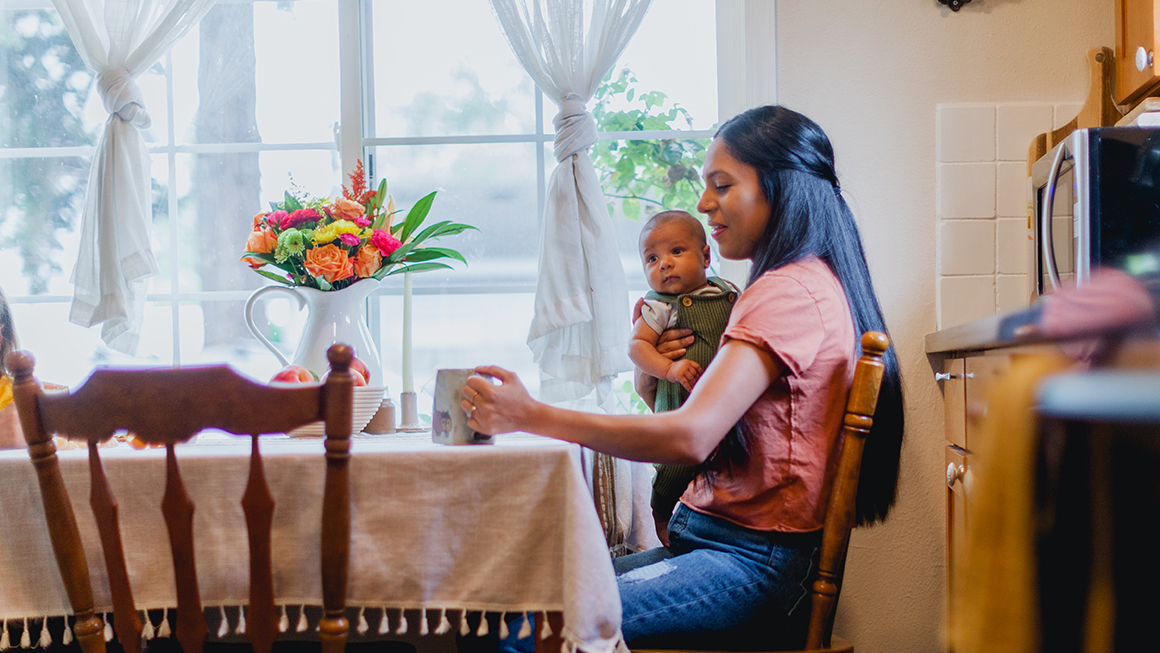 A woman and child at the kitchen table