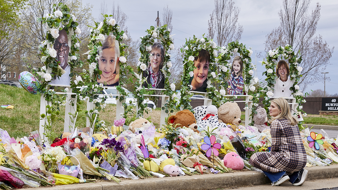 A woman looks on at the memorial for the Covenant School shooting victims at the Covenant School. 
