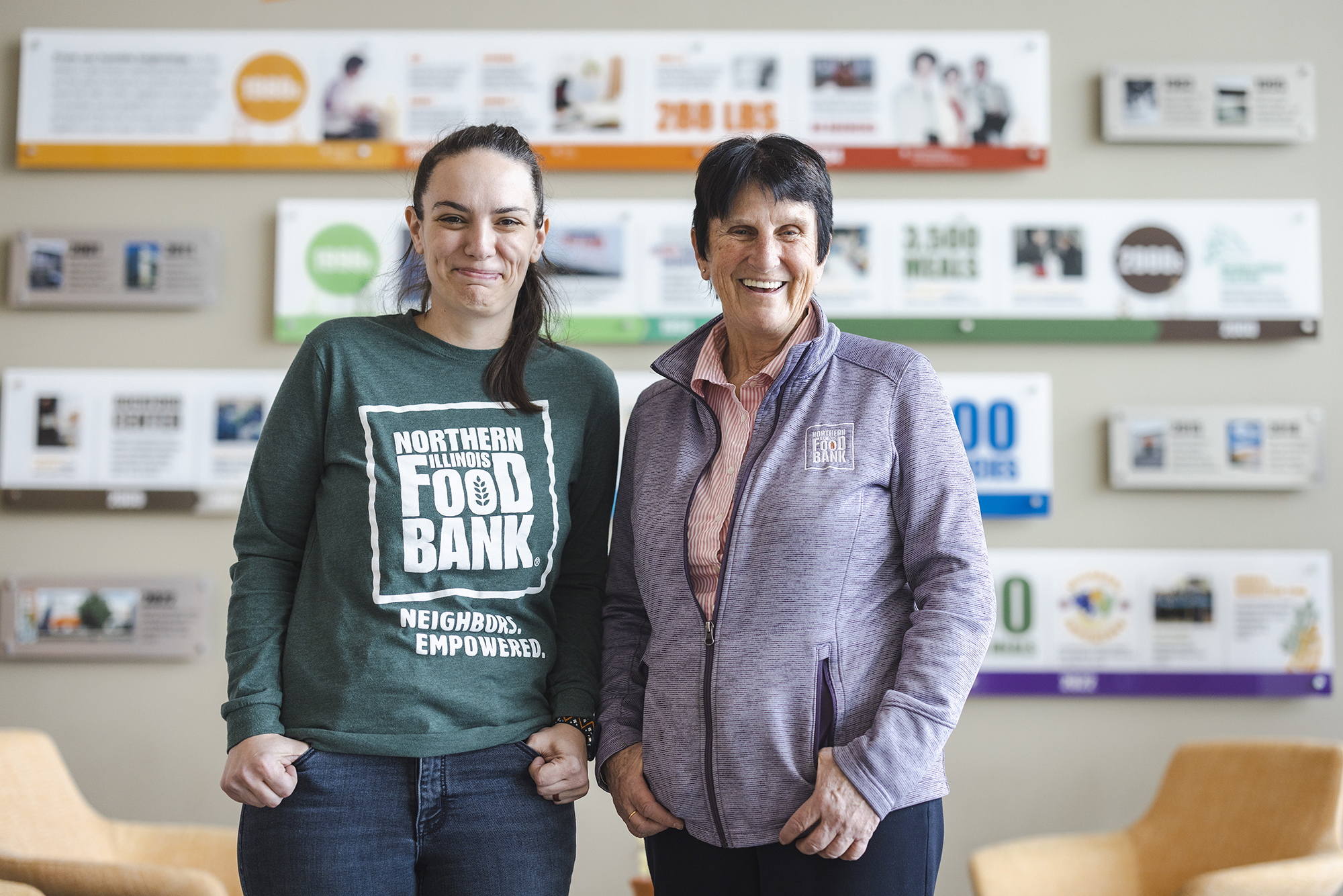 Two women stand side by side for a portrait.