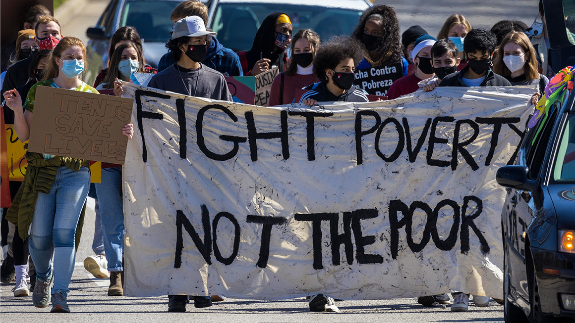Protesters march in the middle of 17th Street on the way to Assembly Hall.
