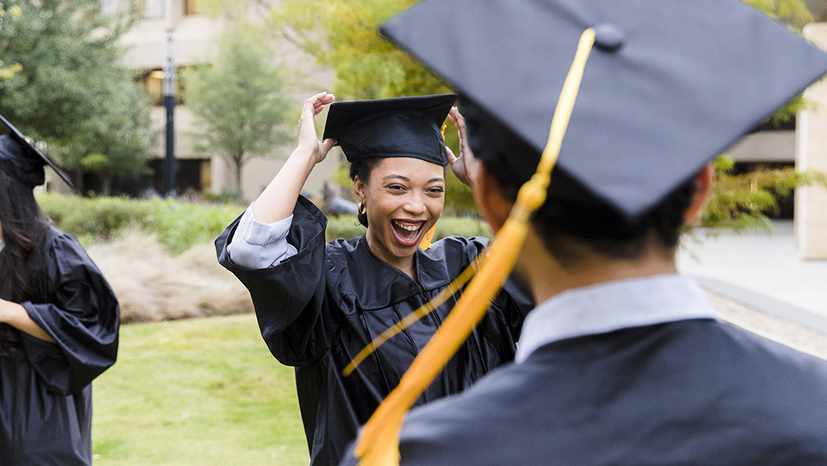 A college graduate outside. 