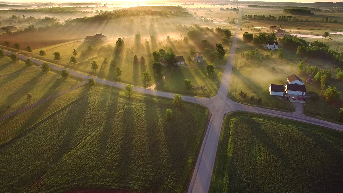 An aerial shot of a rural neighborhood. 