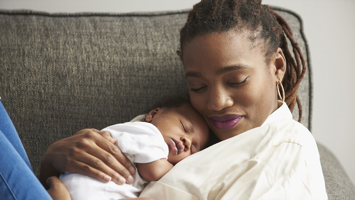 Mom holds her baby