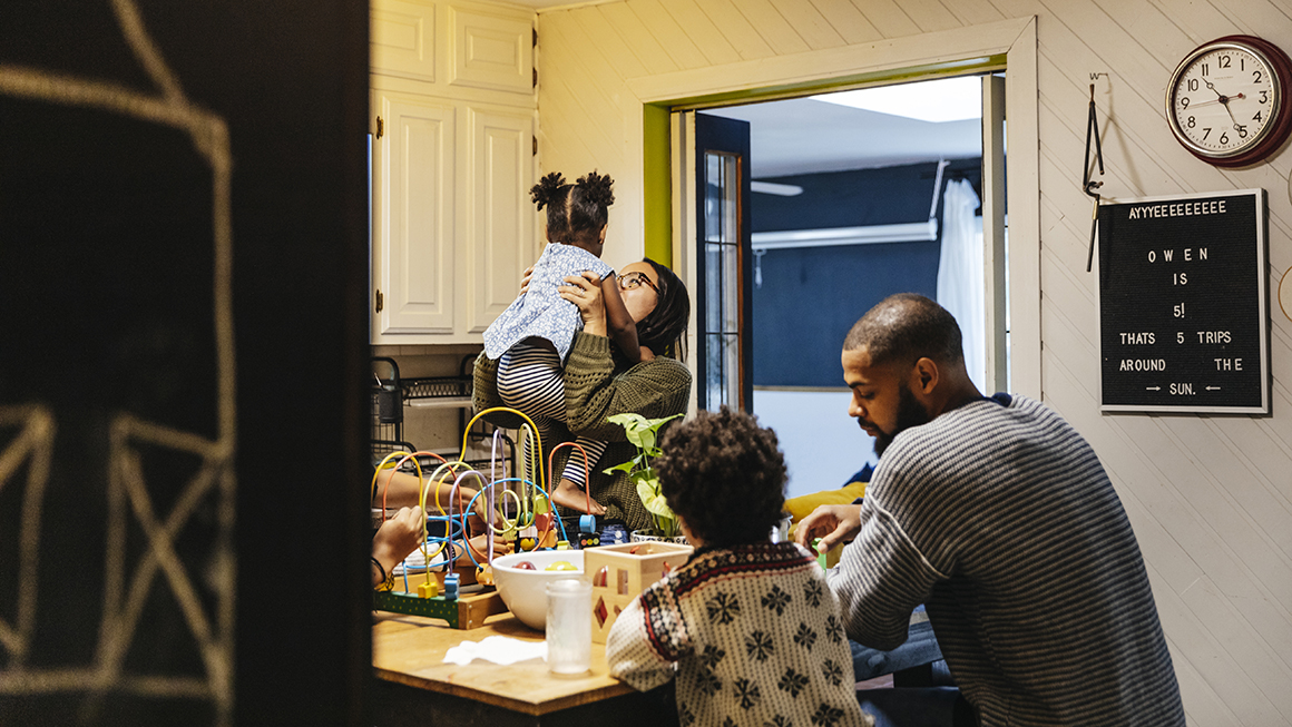 A family at their kitchen island.