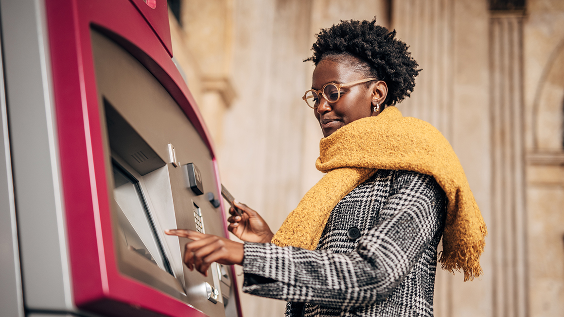 A woman at an ATM.