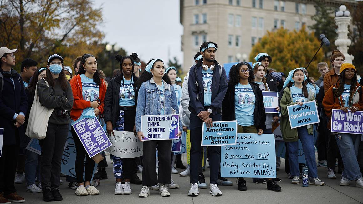 A group of people protesting and marching outside.