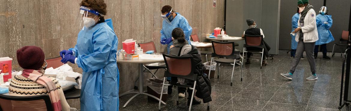 people getting vaccinated at a community health clinic