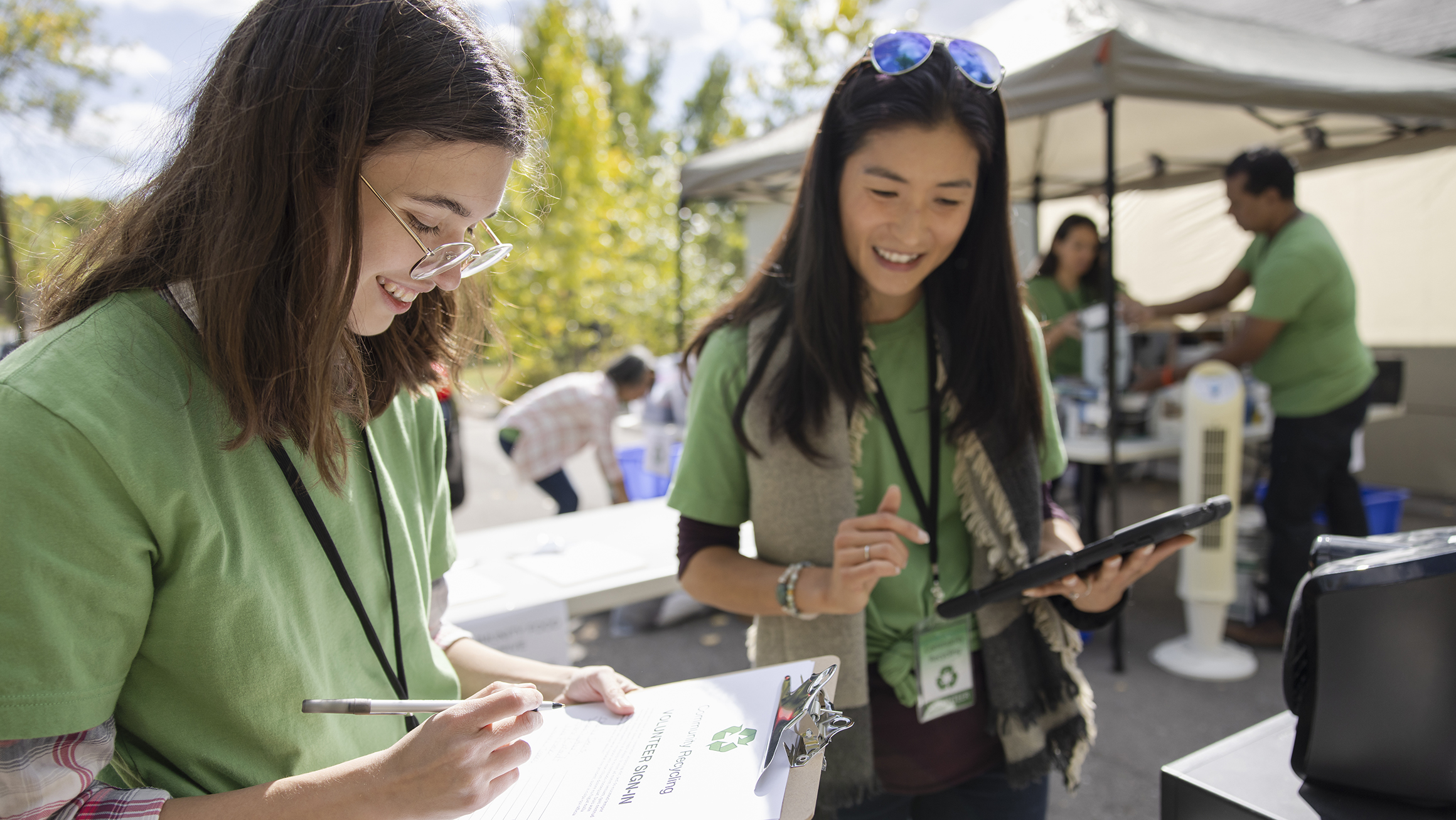 Two young women volunteering.