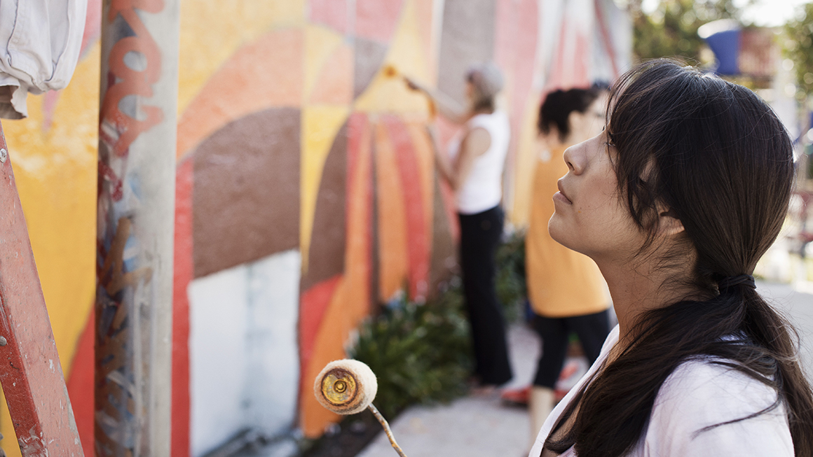 Woman paint art on wall