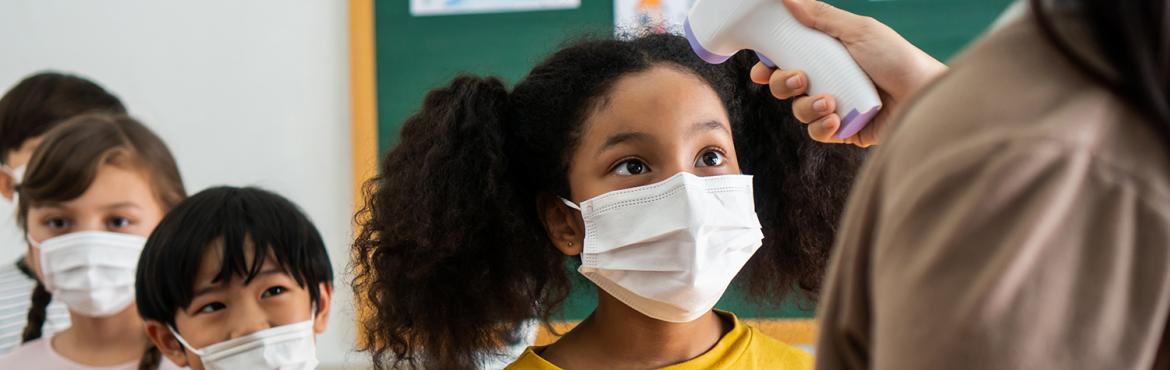 photo of kids wearing masks at school