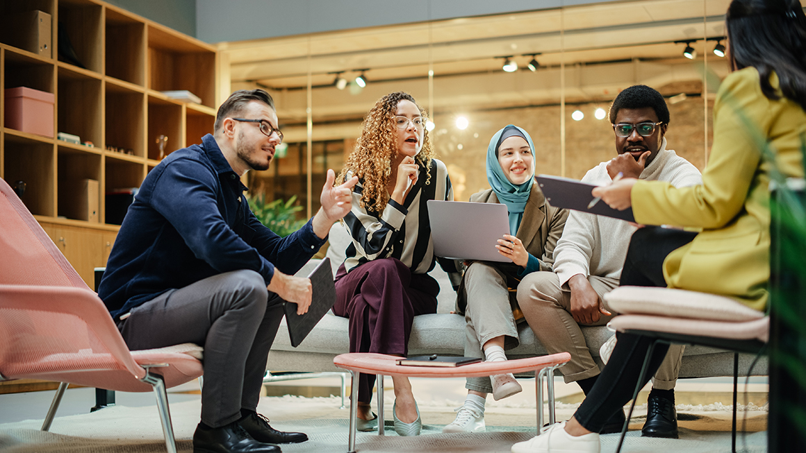 Multi-ethnic group of people discussing ideas in a meeting room in the office.