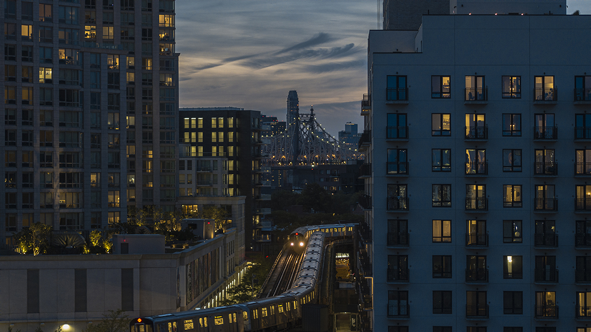 Tall city buildings at nightime.