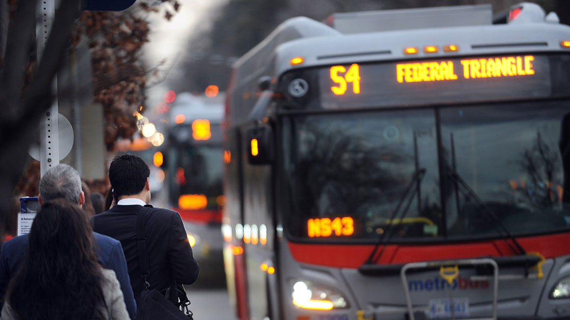 photo of bus riders waiting for a bus on 16th Street near U Street in Washington, DC