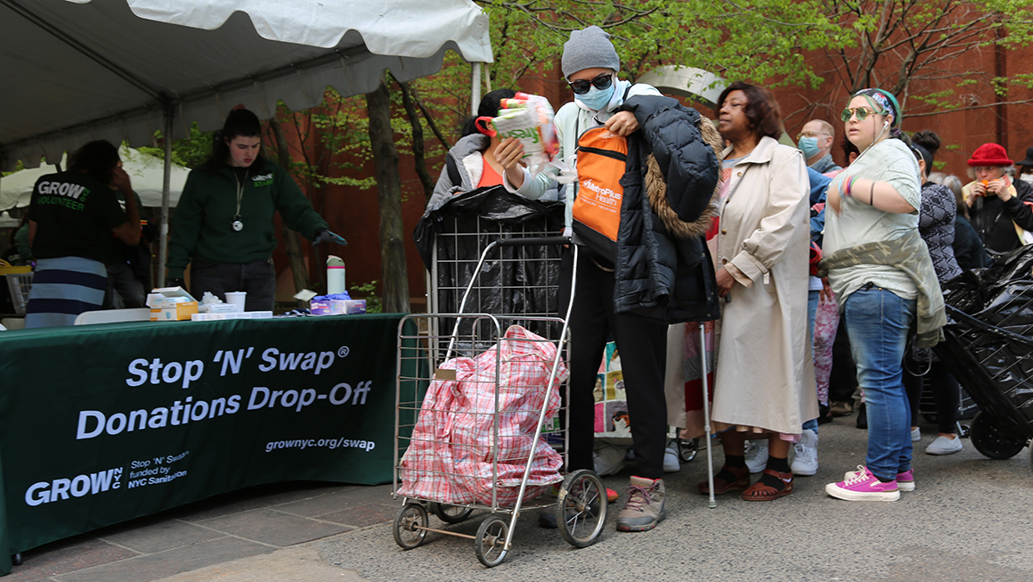 People line up to donate reusable and portable items at an Earth Day Fair in New York, the United States, on April 21, 2023.