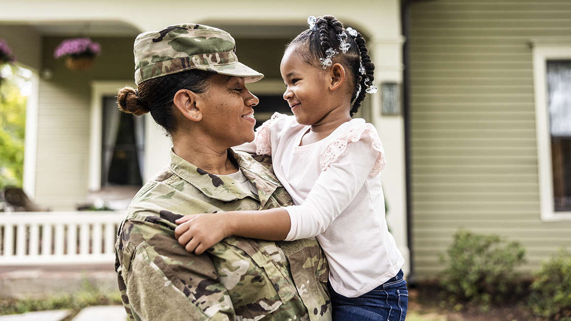 photo of military parent with child