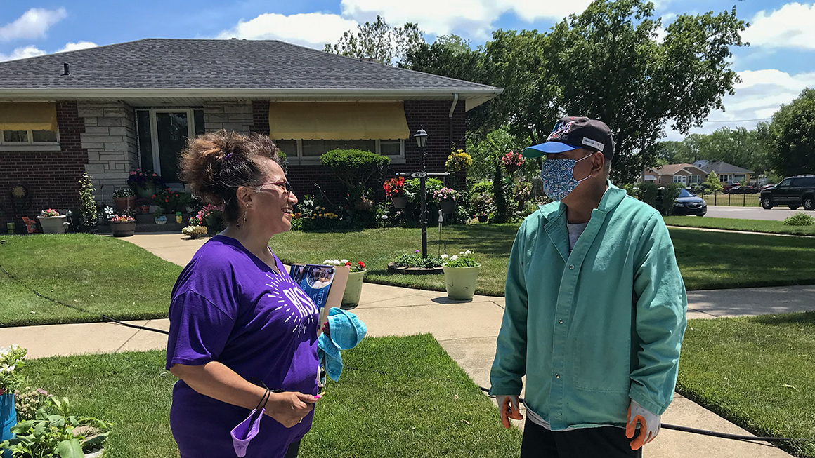 Foundation volunteer speaking with community member