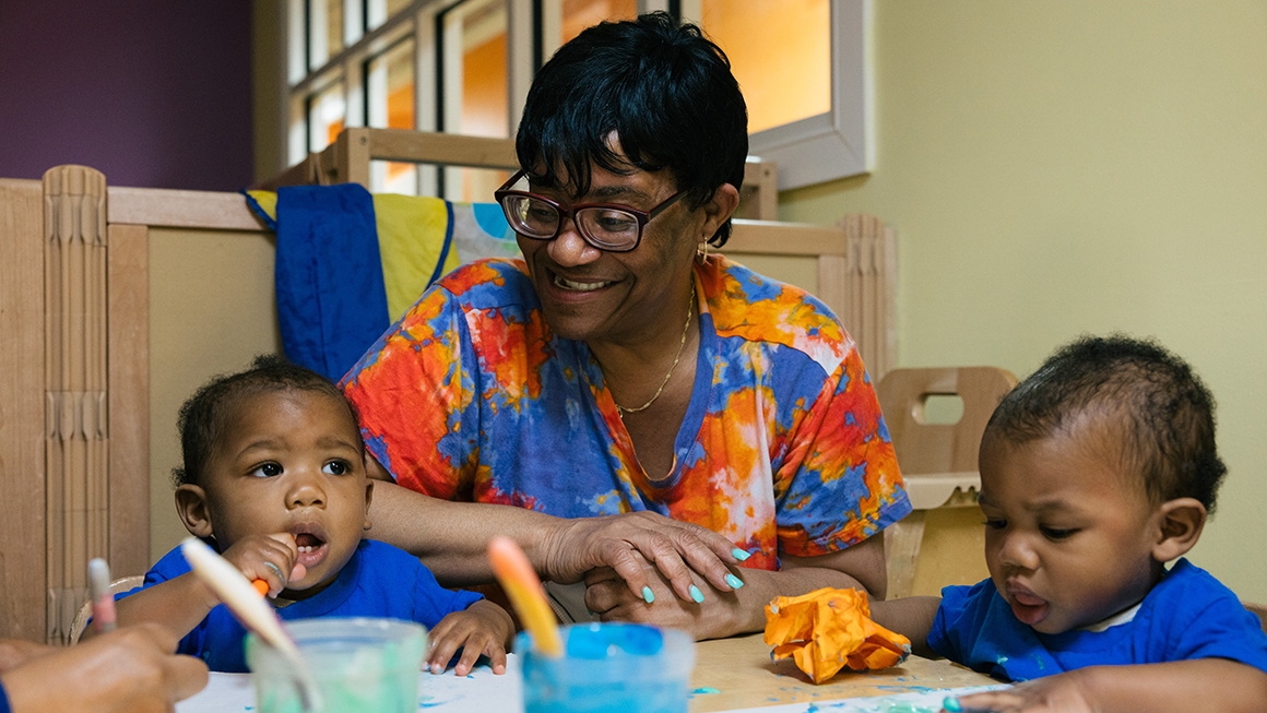 photo of caretaker and children
