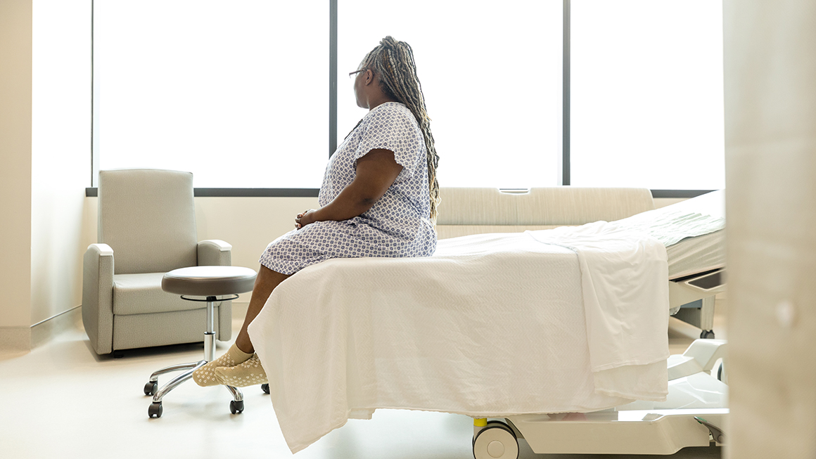 photo of person sitting on hospital bed