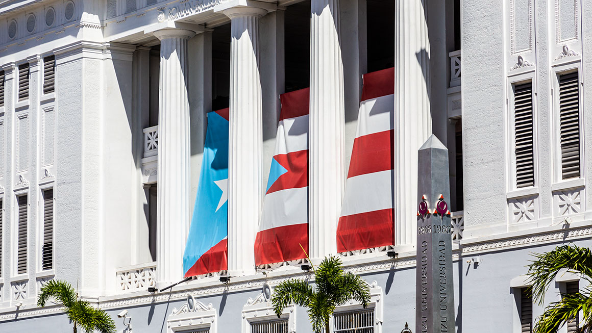 photo of government building in Old San Juan, Puerto Rico with Puerto Rican flag