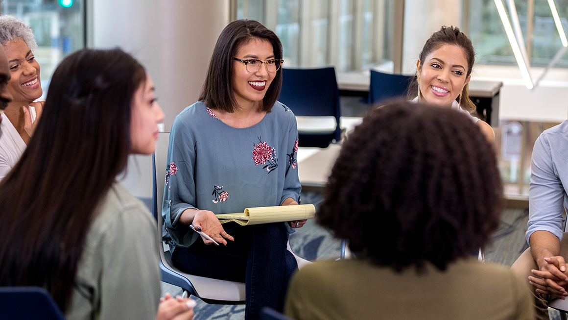 photo of people sitting together in a meeting