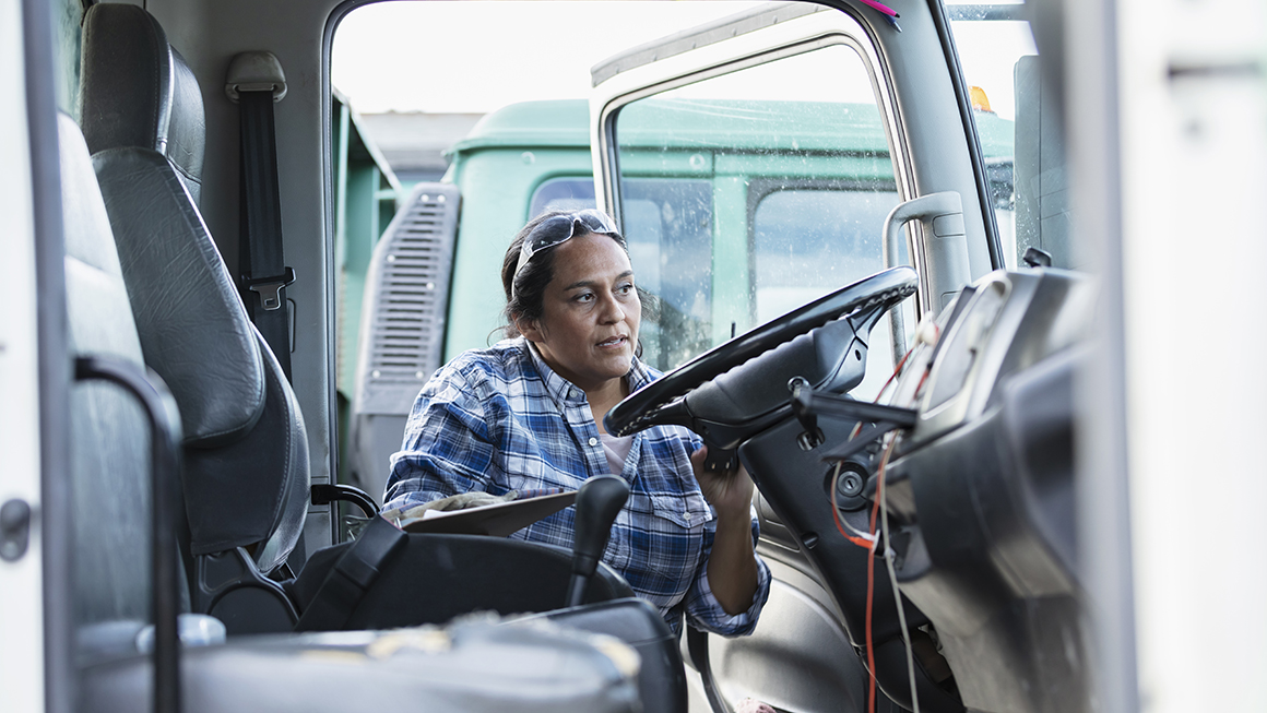 photo of worker getting into truck
