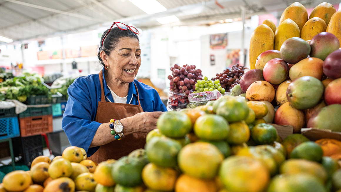 photo of woman at fruit market stand