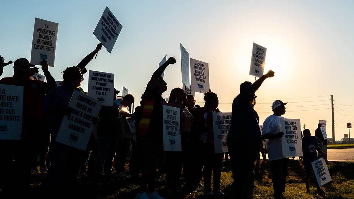Dockworkers strike in a picket line outside of the Port of Houston Authority on October 01, 2024 in Houston, Texas.