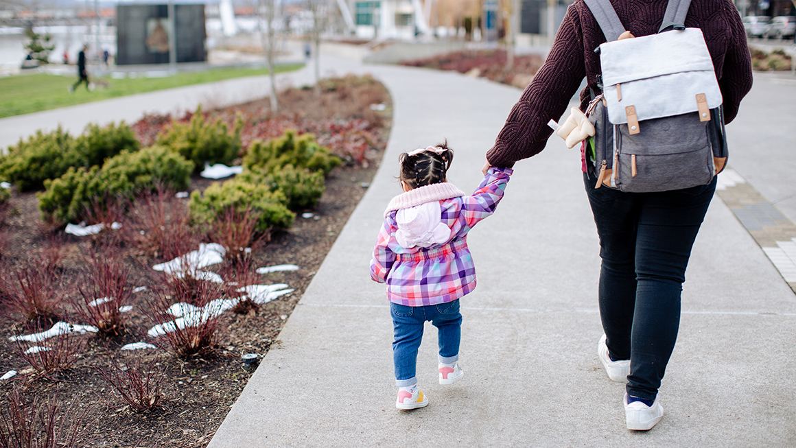 photo of parent walking with child