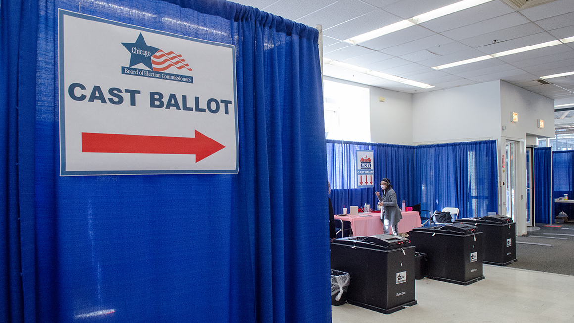 photo of voters casting their ballots at a polling station