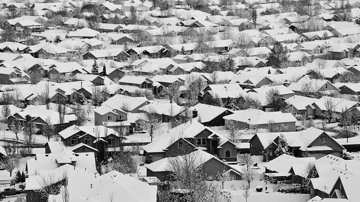 photo of snowy rooftops huddled together in this suburban winter scene
