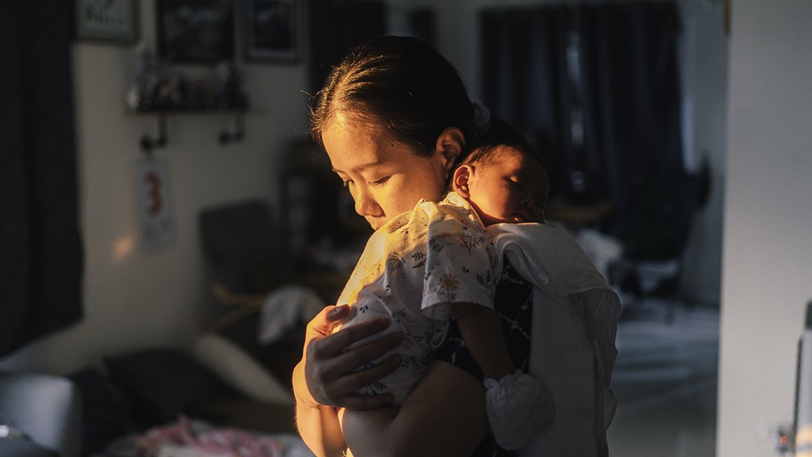 photo of parent holding child