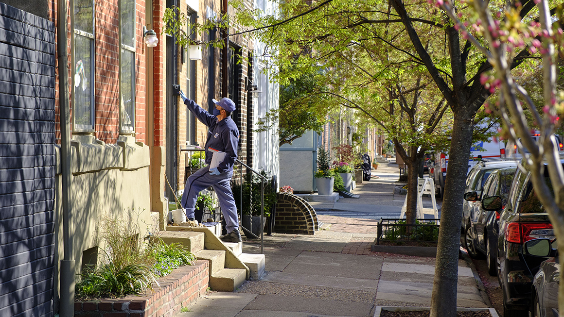 photo of US Postal Delivery on city street