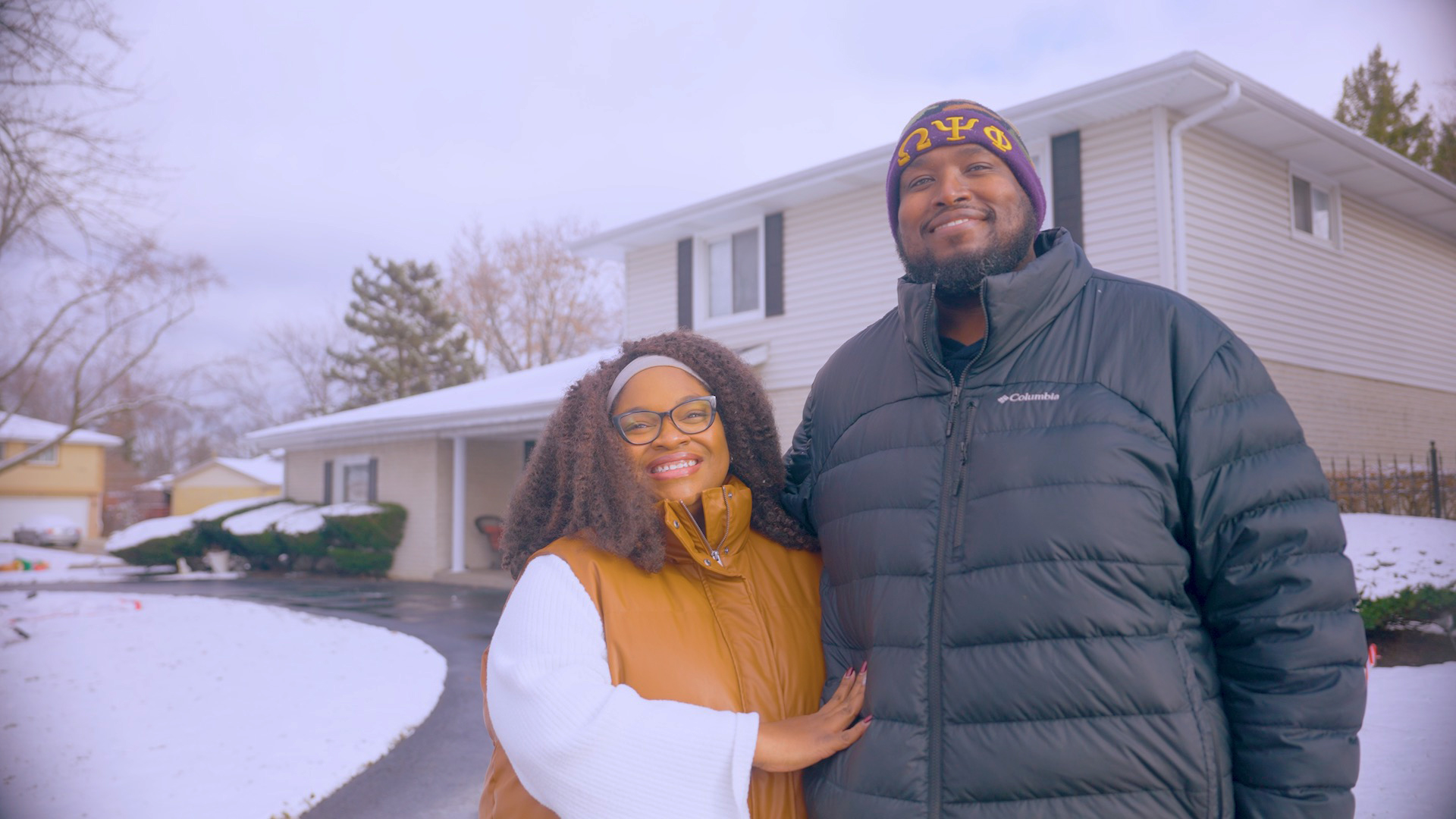 Courtney Brunson (right) and his wife stand outside their suburban home in Des Plaines, Illinois, where they live with their three children.