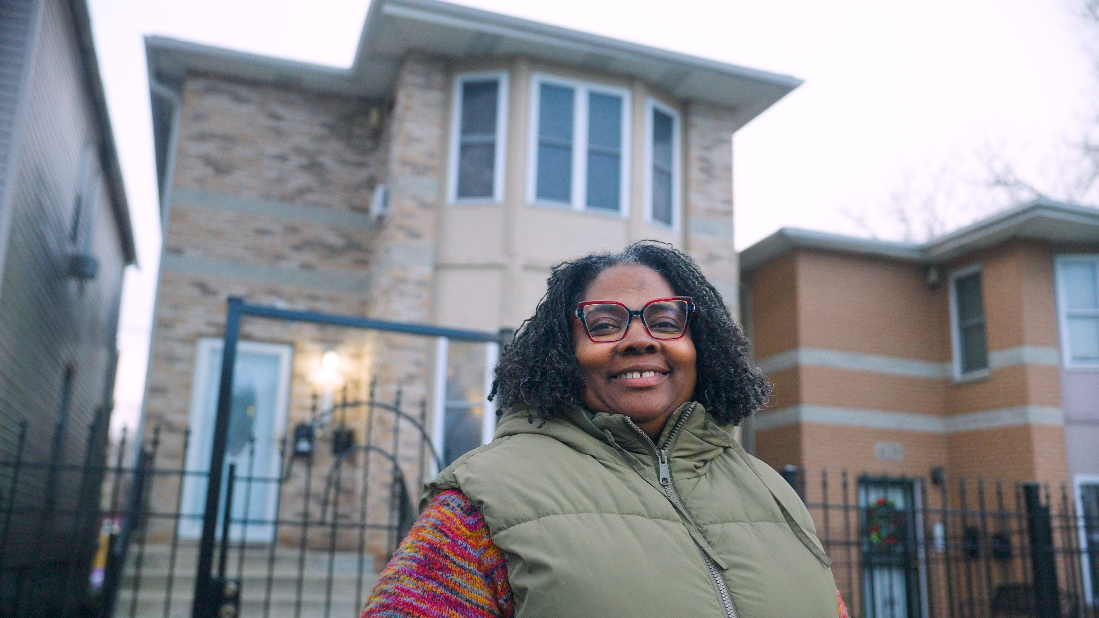 Neshell Robinson stands outside her mutlifamily home in the Inglewood neighborhood of Chicago, Illinois. 