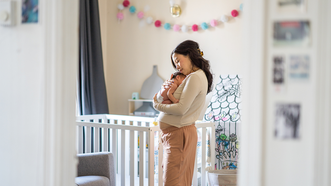 Mother with her child in her home.