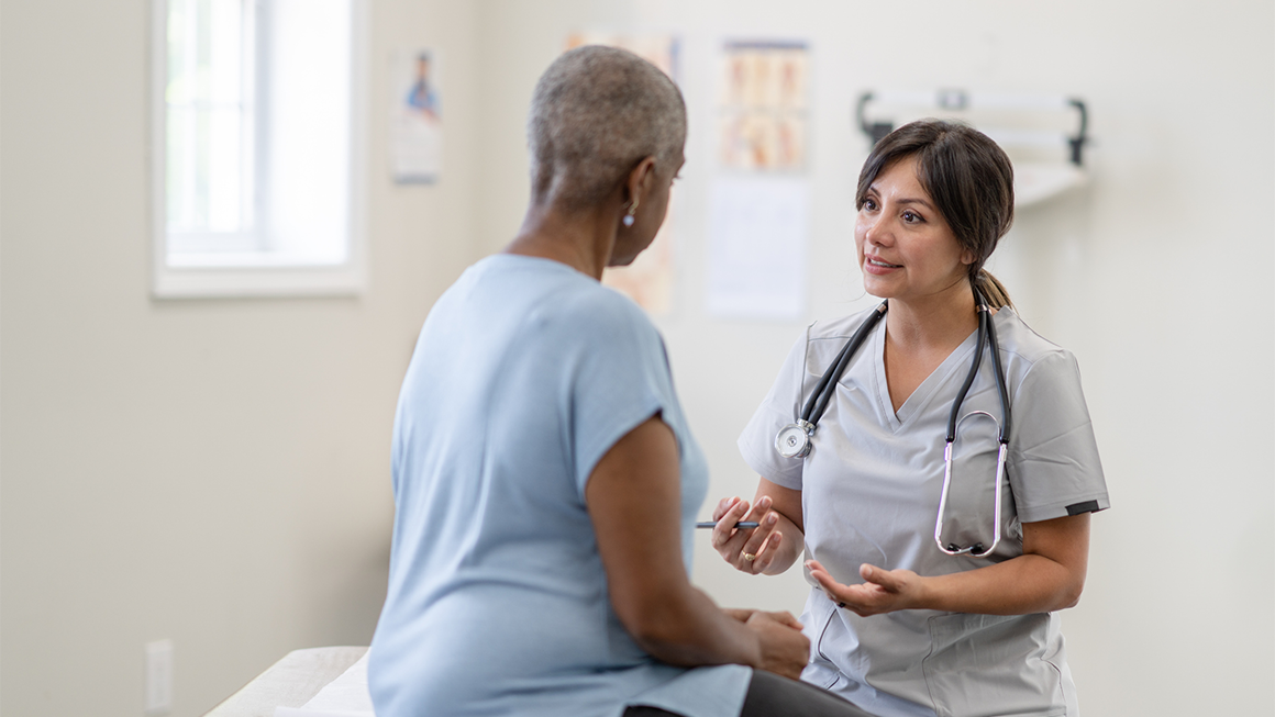 Older woman seeing a medical profesional 