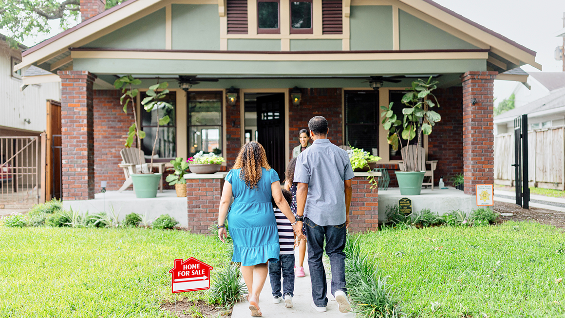 A family taking a tour of a for sale home.
